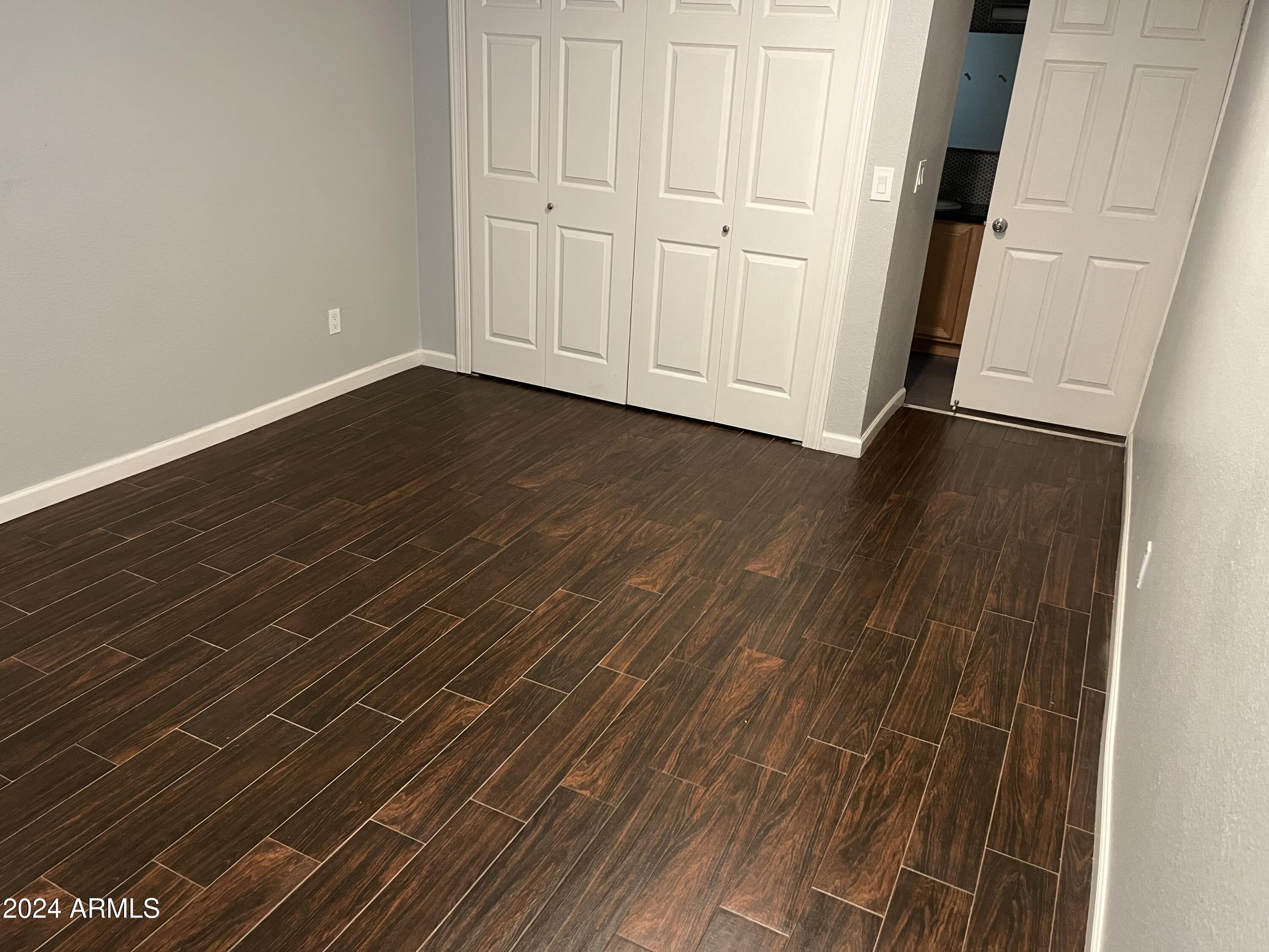740 West Elm Street, Unit 110 Phoenix, AZ 85013 - Photo 13 of 22 a view of a livingroom with wooden floor
