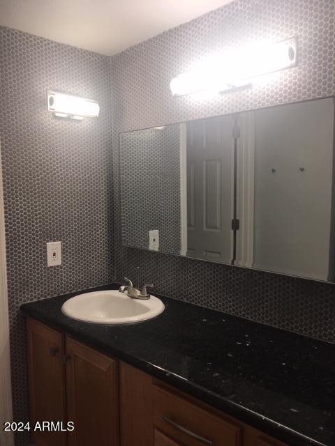740 West Elm Street, Unit 110 Phoenix, AZ 85013 - Photo 16 of 22 a bathroom with a sink and a mirror