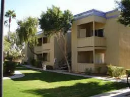 a view of a house with entryway and plants