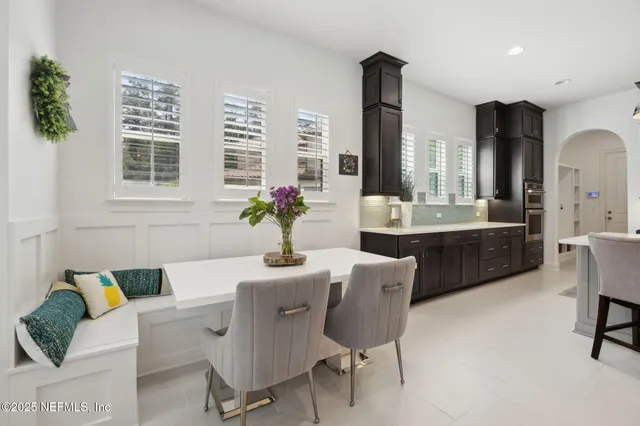a view of a patio with swimming pool table and chairs