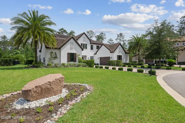 a living room with furniture fireplace and flat screen tv