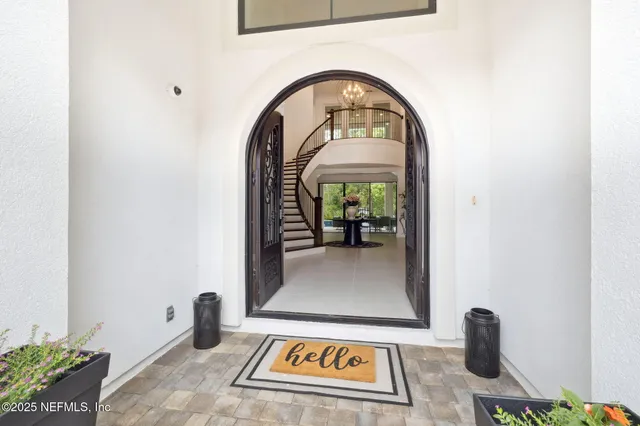 a view of a big room with wooden floor windows and fireplace