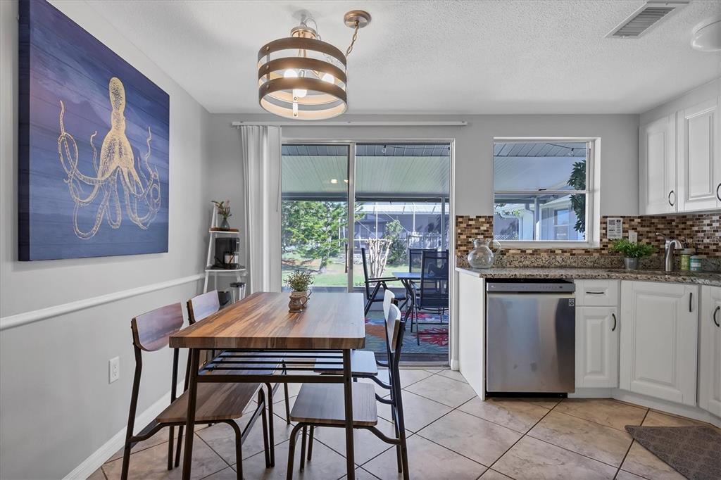 2323 Doud Street Sarasota, FL 34231 - Photo 12 of 34 a view of a dining room with furniture window and outside view