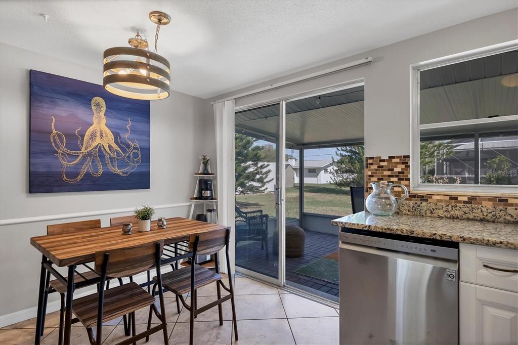 2323 Doud Street Sarasota, FL 34231 - Photo 15 of 34 a dining room with furniture and wooden floor