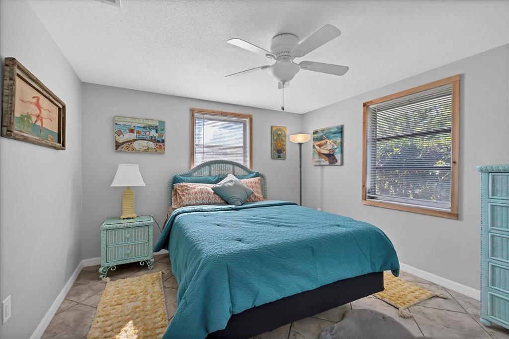 2323 Doud Street Sarasota, FL 34231 - Photo 16 of 34 a bedroom with a bed and a window