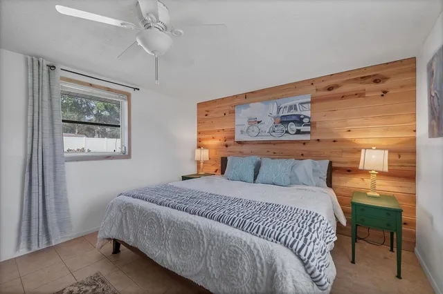 a bedroom with a bed and a table in it