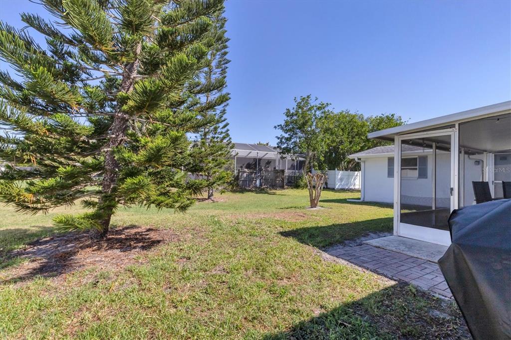 2323 Doud Street Sarasota, FL 34231 - Photo 30 of 34 a view of a house with a yard