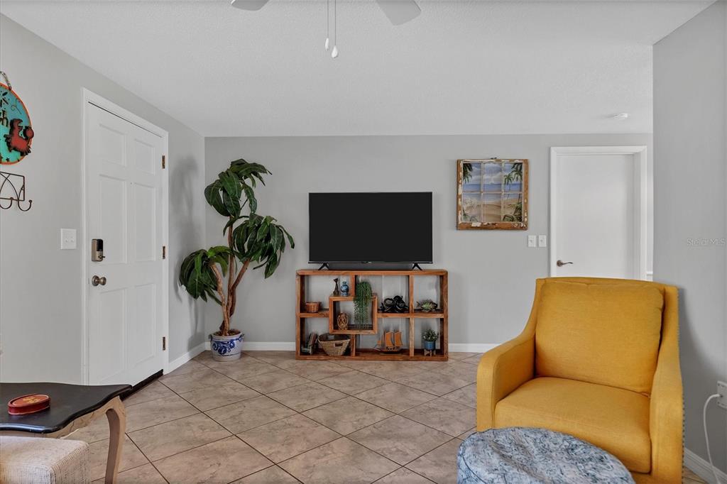 2323 Doud Street Sarasota, FL 34231 - Photo 10 of 34 a living room with furniture and a flat screen tv