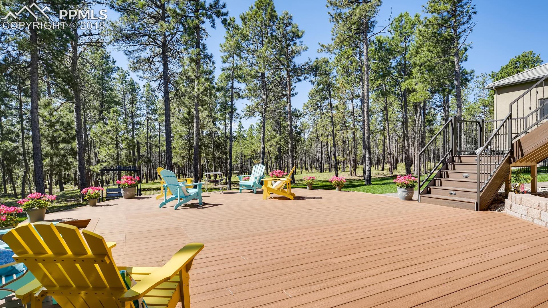 4061 High Forest Road Colorado Springs, CO 80908 - Photo 26 of 40 ...walk-out to large composite deck with privacy and views...