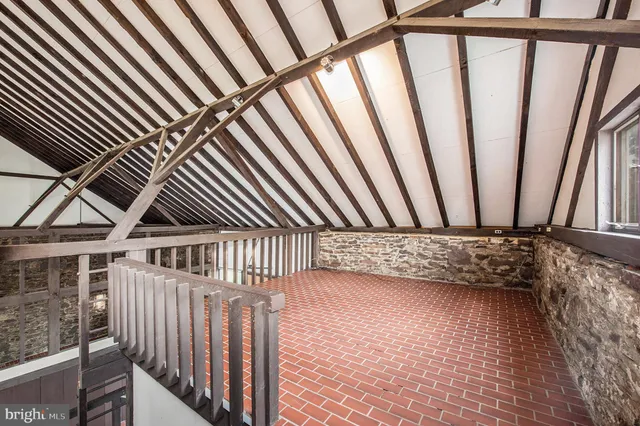 a view of a house with pool and wooden floor