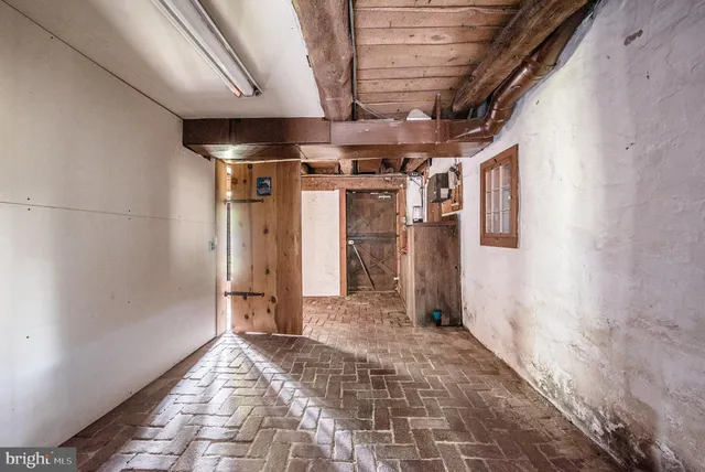 a bathroom with a granite countertop toilet a sink and a mirror