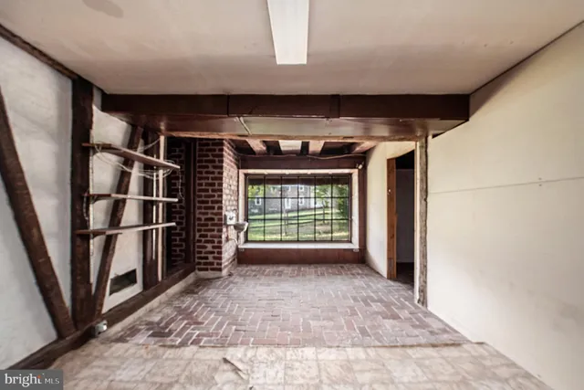 a brick building with a bench in front of it