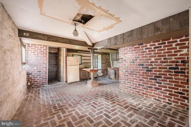 front view of a house with a tree