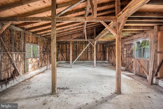 a aerial view of a house with a yard and potted plants