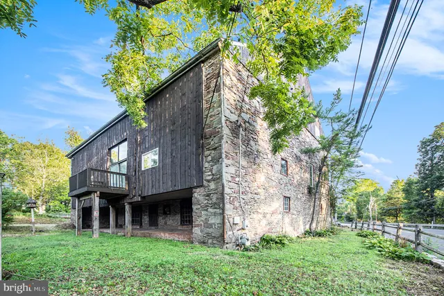 a aerial view of a house with a yard and potted plants