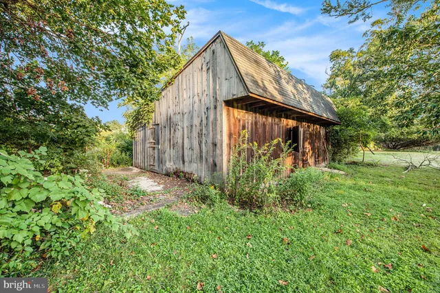 an aerial view of a house with outdoor space