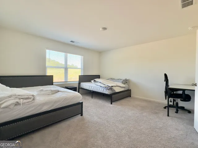 a bathroom with a double vanity sink mirror and toilet