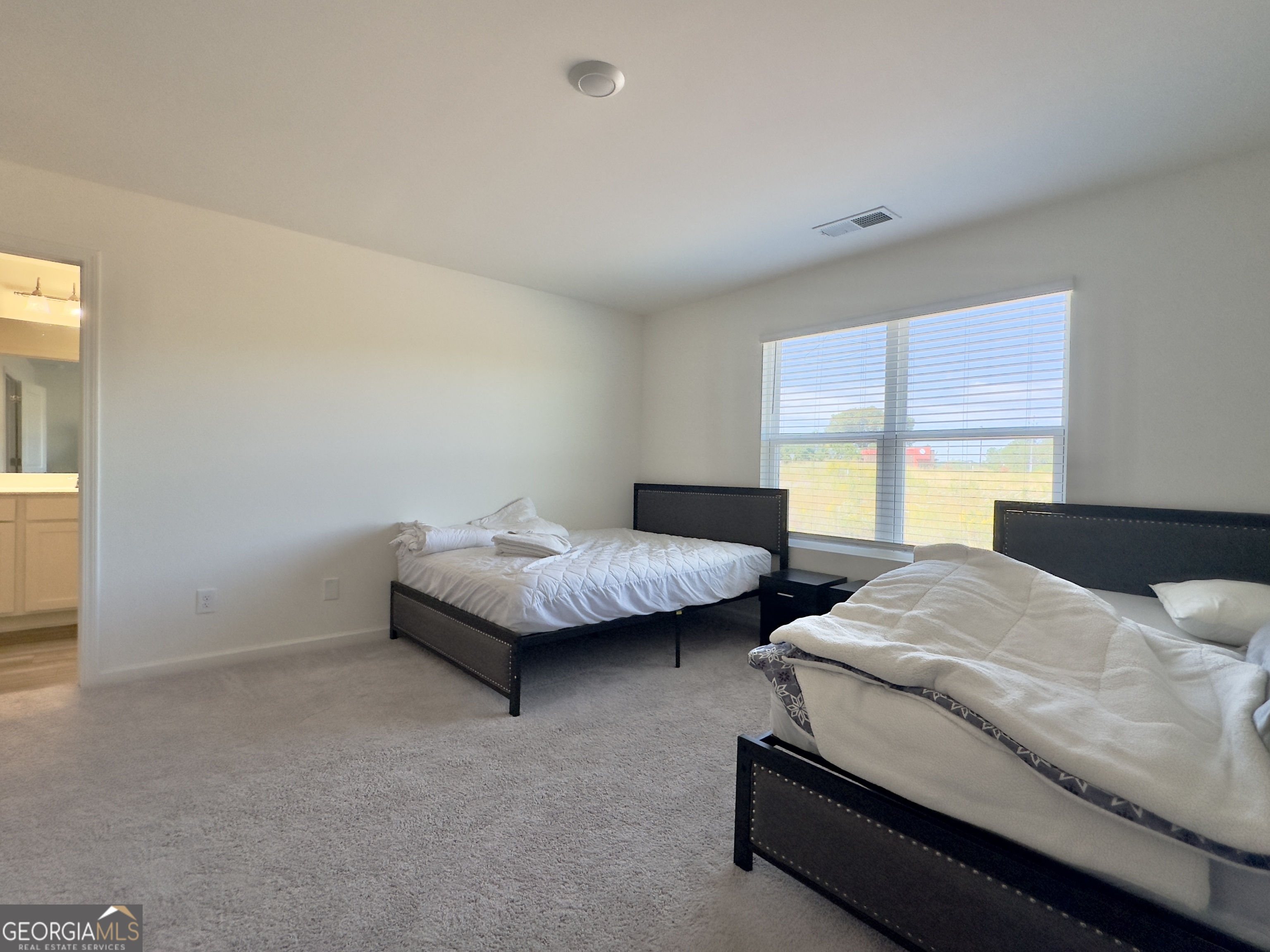 105 Ellicott Way Cartersville, GA 30120 - Photo 12 of 24 a bedroom with two beds and a couch