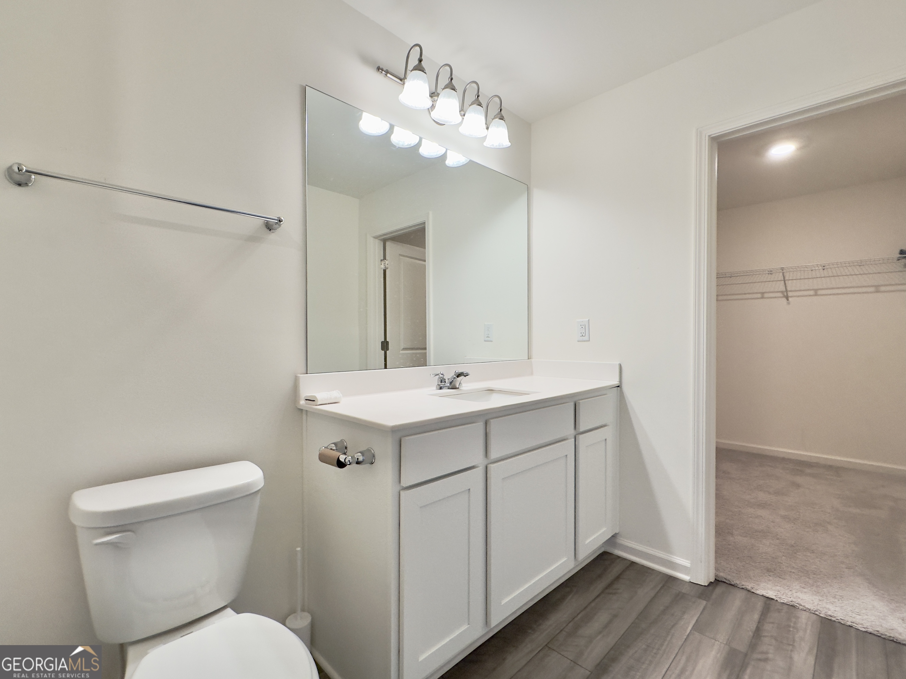 105 Ellicott Way Cartersville, GA 30120 - Photo 14 of 24 a bathroom with a toilet sink and mirror