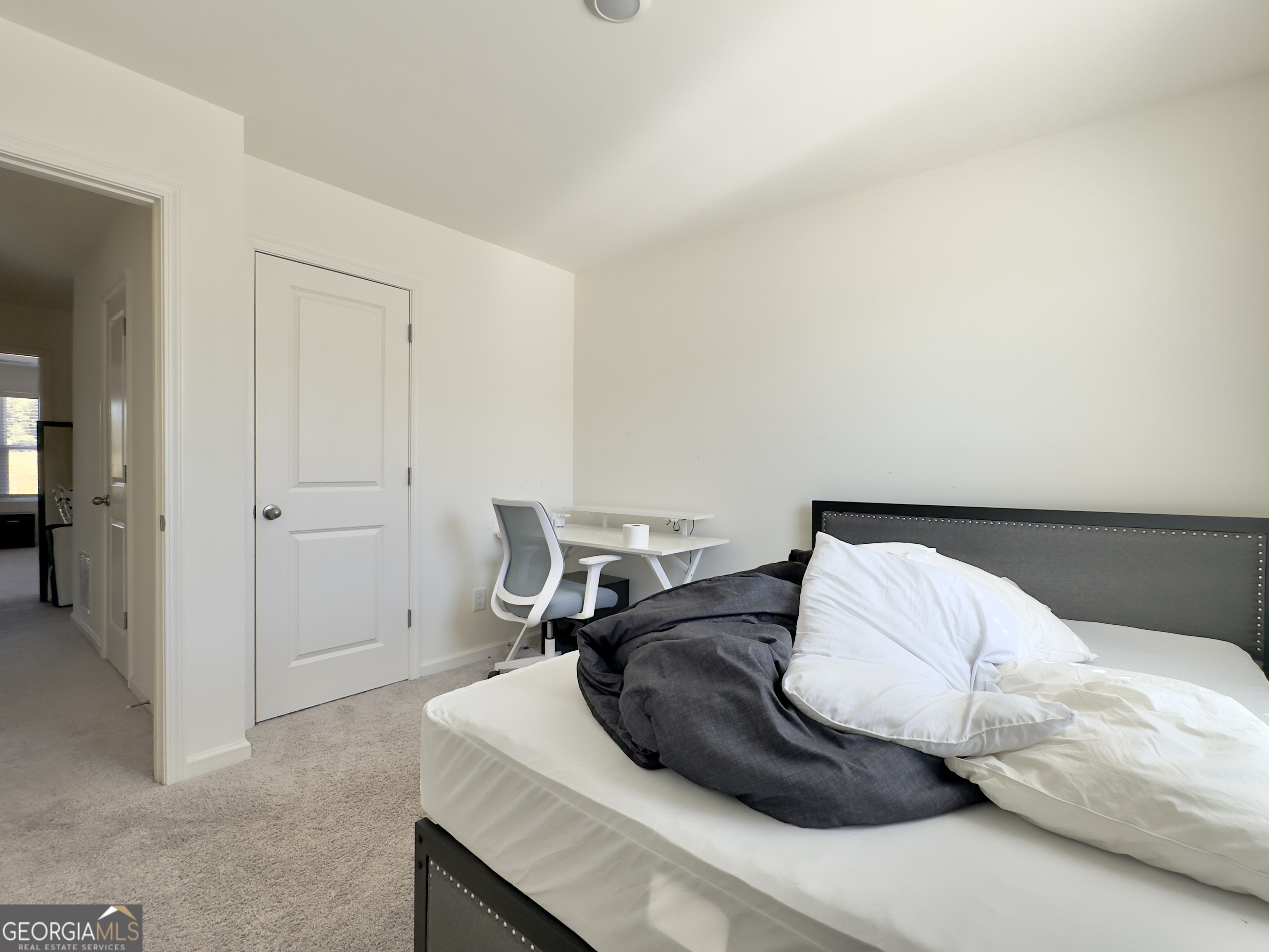 105 Ellicott Way Cartersville, GA 30120 - Photo 18 of 24 a bedroom with a bed and mirror