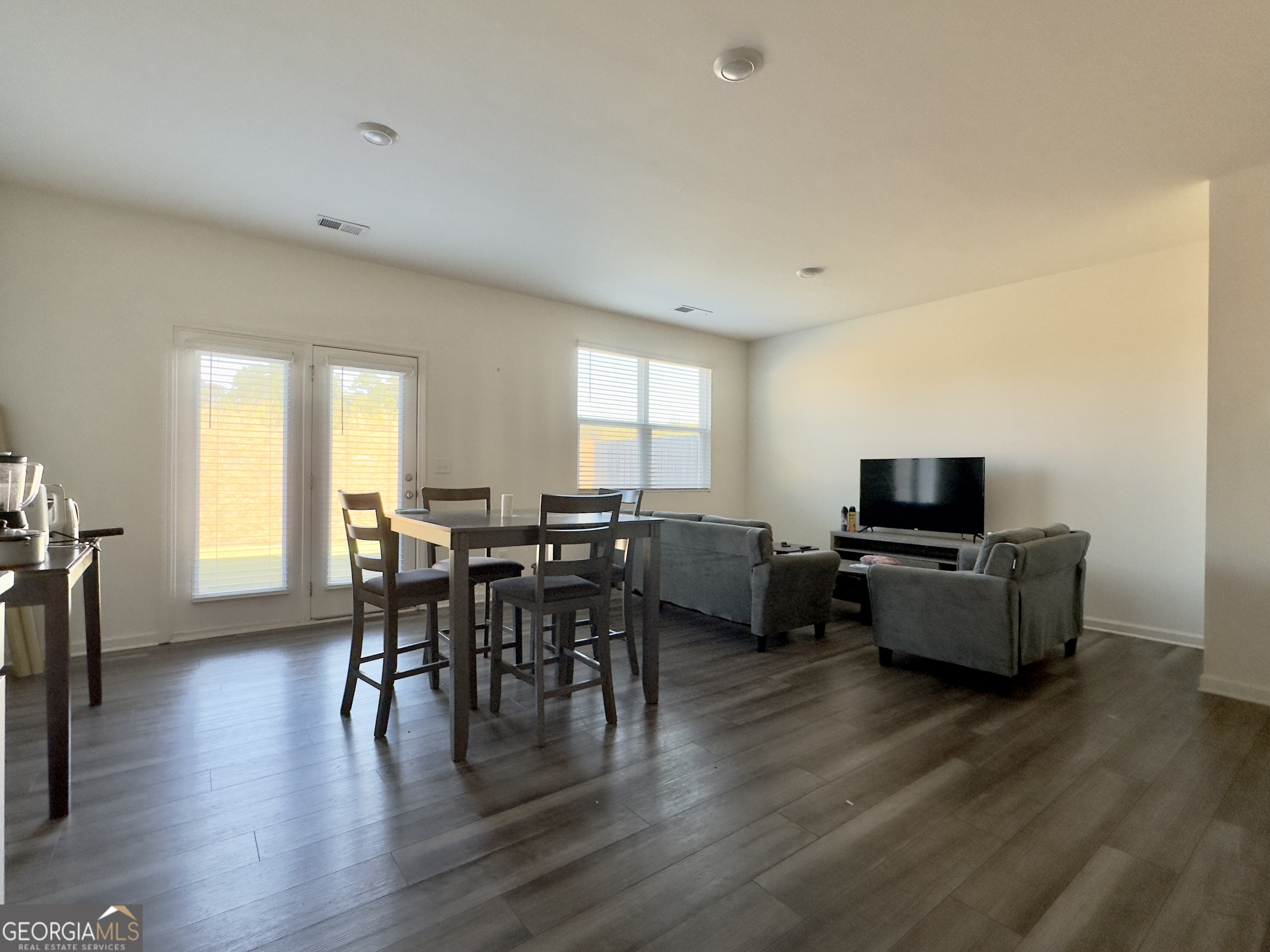 105 Ellicott Way Cartersville, GA 30120 - Photo 8 of 24 a living room with furniture a wooden floor and a flat screen tv