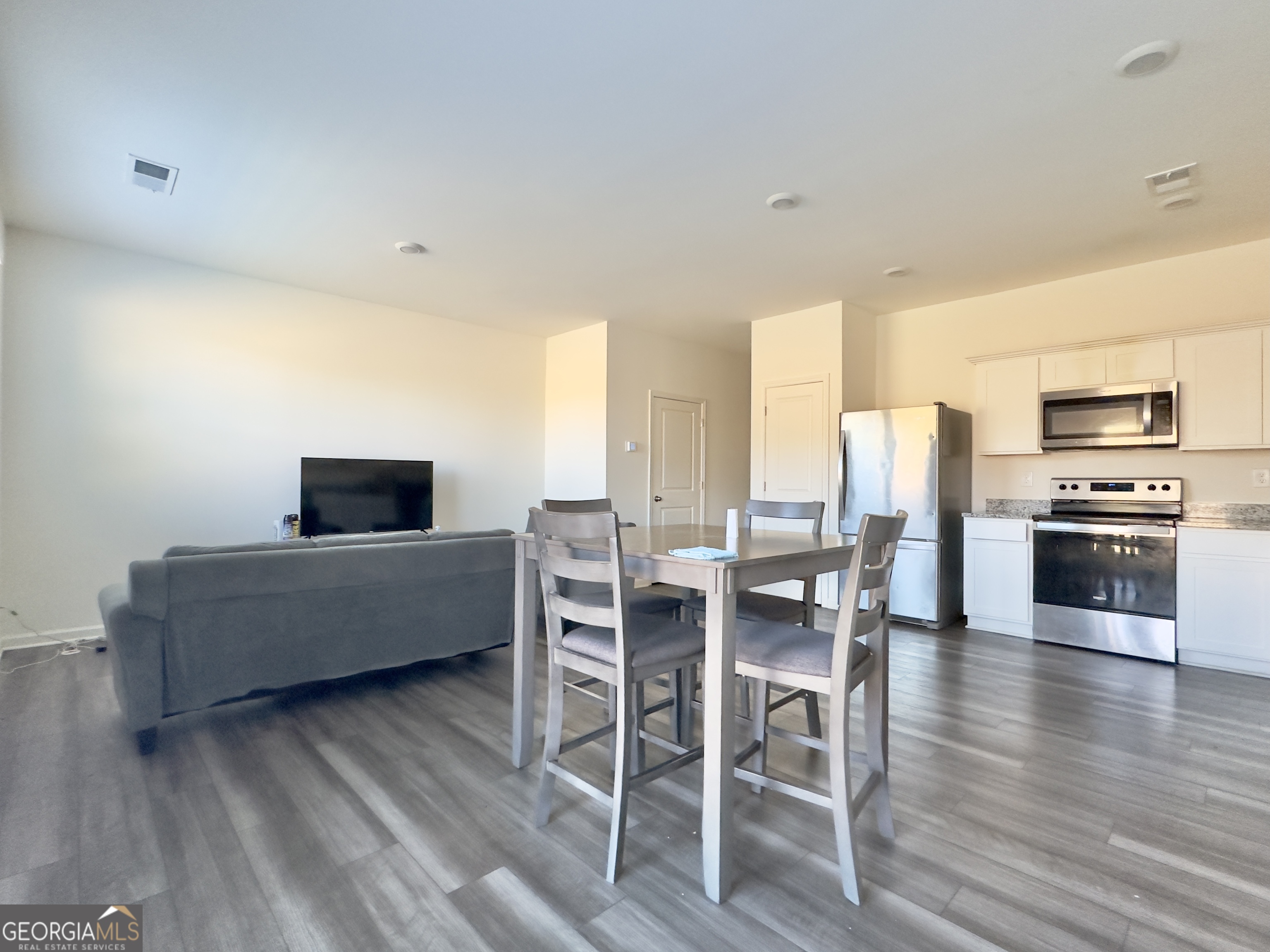 105 Ellicott Way Cartersville, GA 30120 - Photo 9 of 24 a living room with furniture wooden floor and a flat screen tv