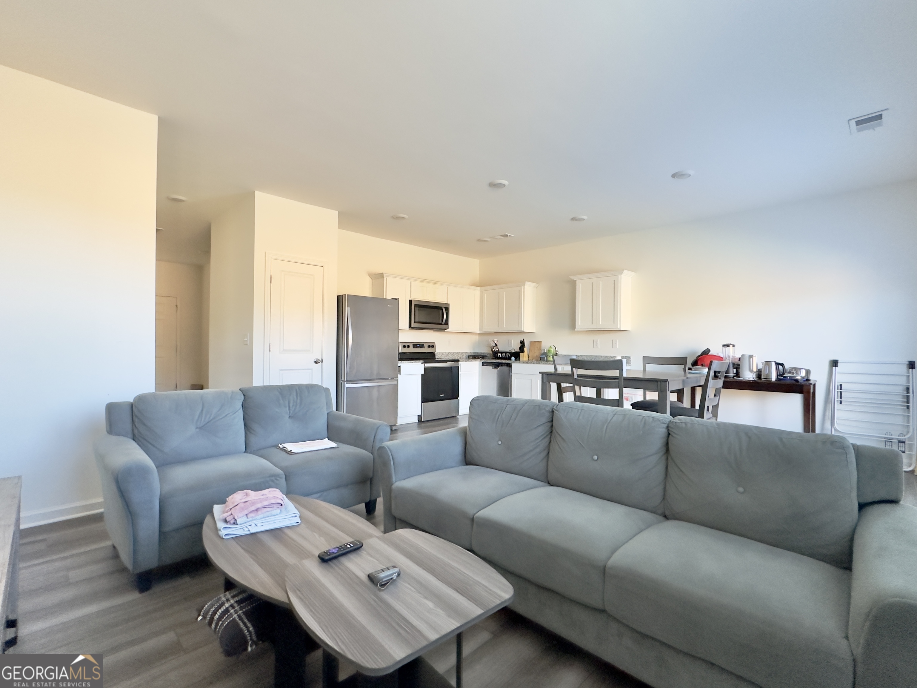 105 Ellicott Way Cartersville, GA 30120 - Photo 10 of 24 a living room with furniture and a view of kitchen