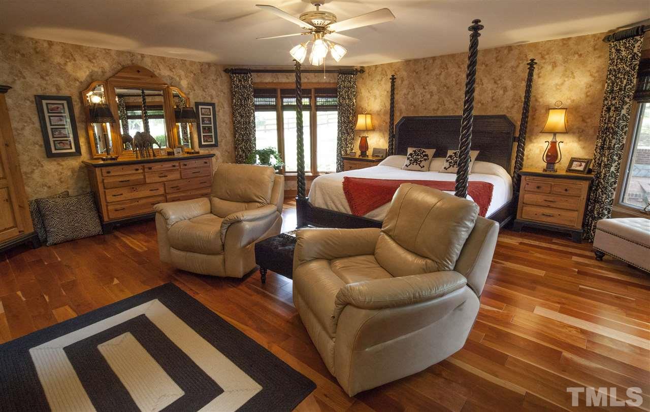 3529 Old Milburnie Road Raleigh, NC 27616 - Photo 11 of 25 a living room with furniture and a chandelier