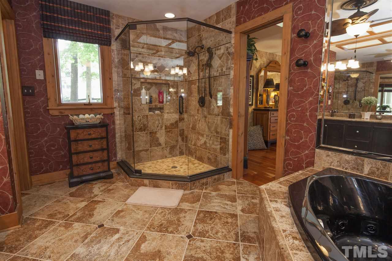 3529 Old Milburnie Road Raleigh, NC 27616 - Photo 13 of 25 a bathroom with a sink toilet and shower