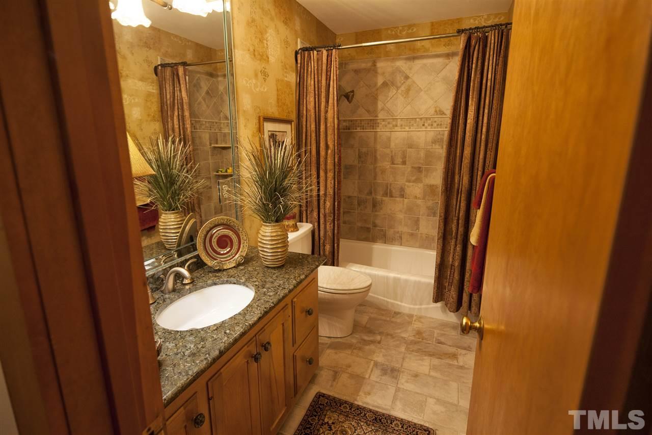 3529 Old Milburnie Road Raleigh, NC 27616 - Photo 15 of 25 a bathroom with a sink a toilet a mirror and shower