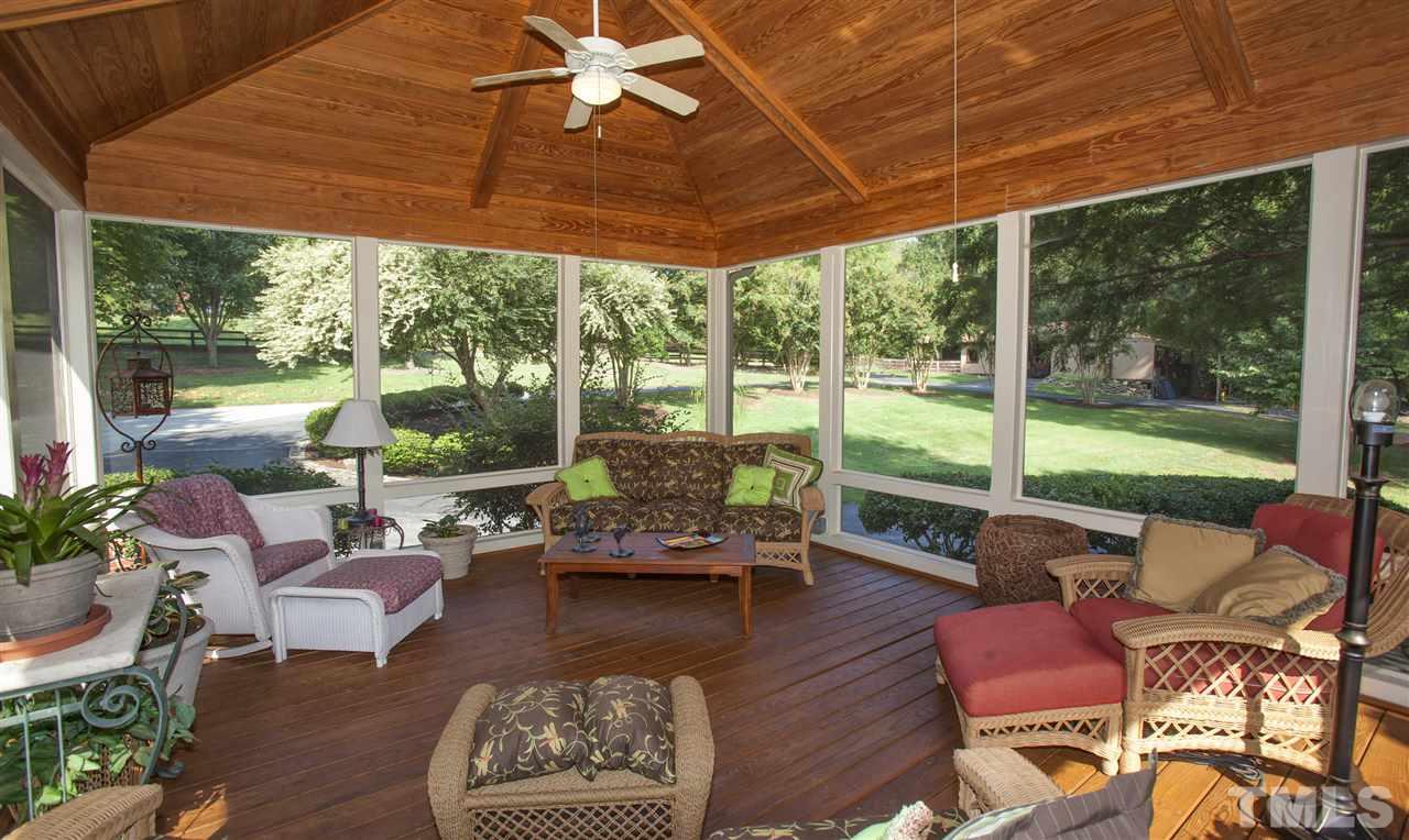 3529 Old Milburnie Road Raleigh, NC 27616 - Photo 17 of 25 a living room with patio furniture and a floor to ceiling window