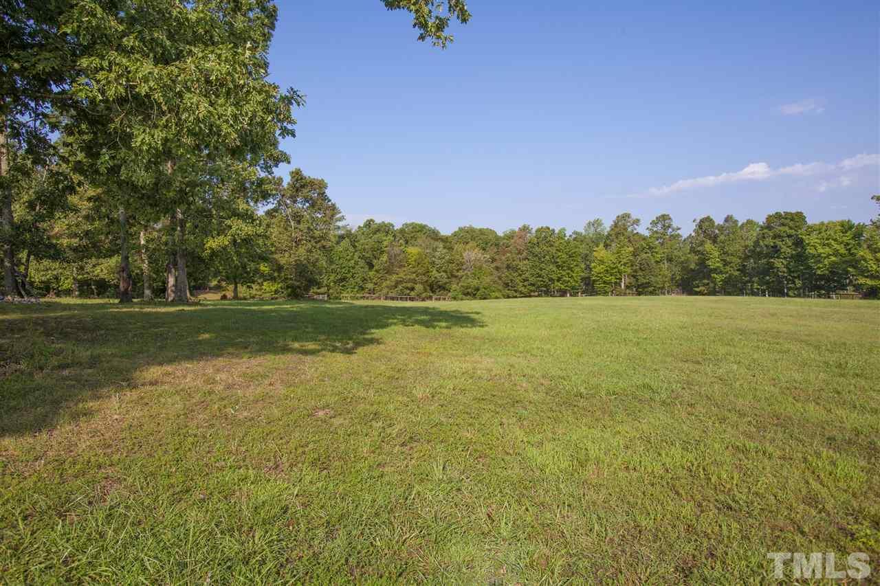 3529 Old Milburnie Road Raleigh, NC 27616 - Photo 23 of 25 a view of a lake with houses in the back