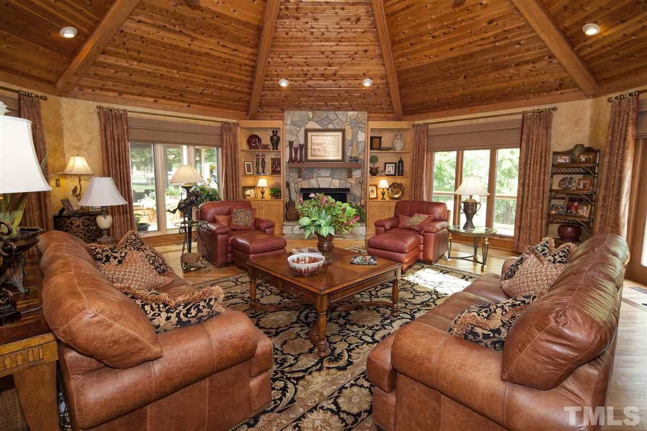 3529 Old Milburnie Road Raleigh, NC 27616 - Photo 5 of 25 a living room with furniture and a chandelier