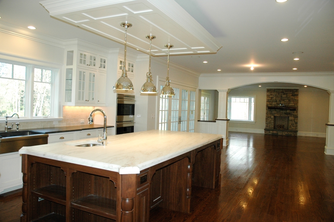 21 Rilling Ridge New Canaan, CT 06840 - Photo 3 of 11 a kitchen with a stove a refrigerator a sink dishwasher with a dining table and chairs with wooden floor