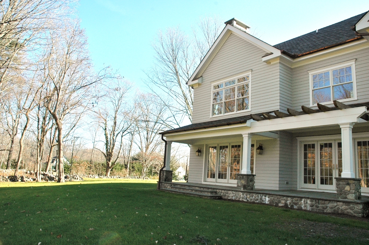 21 Rilling Ridge New Canaan, CT 06840 - Photo 7 of 11 front view of a house with a yard