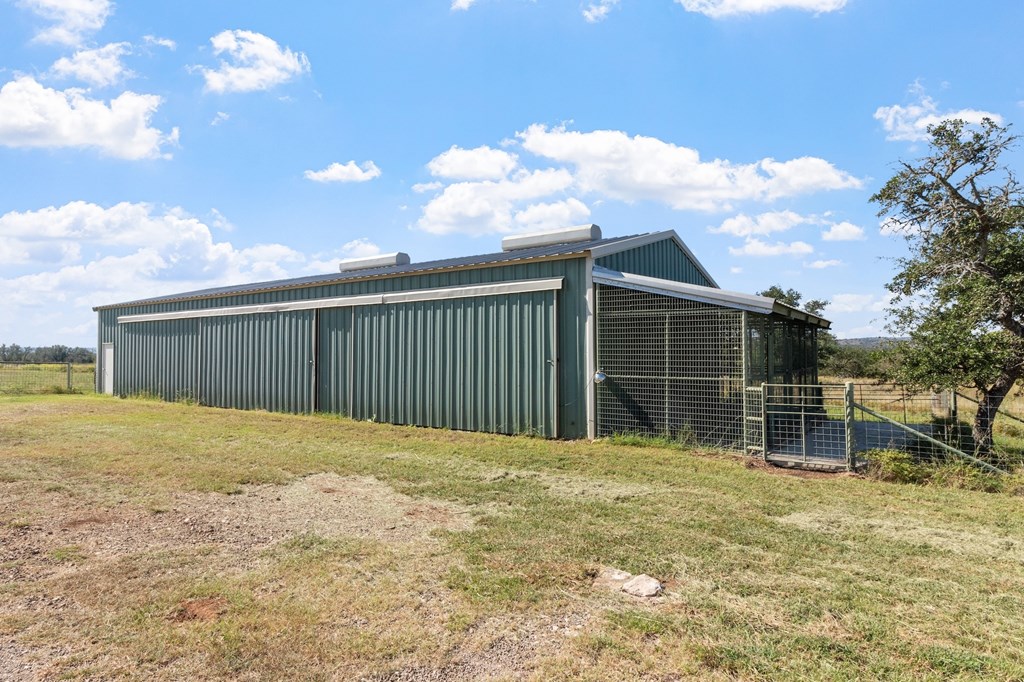 647 Funf Kinder Road Fredericksburg, TX 78624 - Photo 12 of 100 a view of a backyard of the house