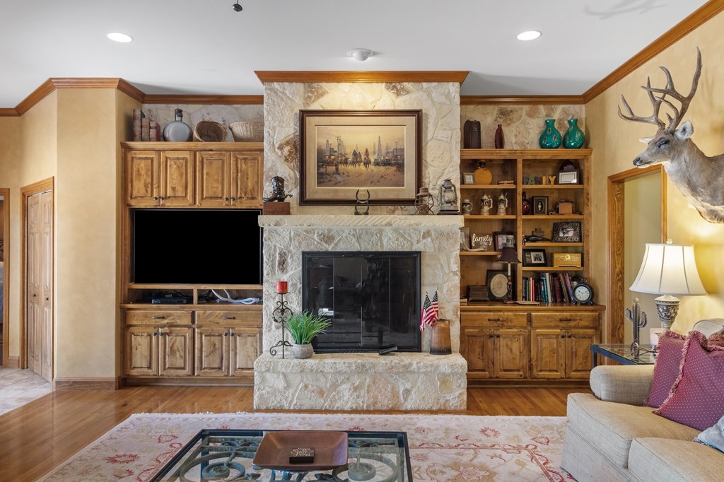 647 Funf Kinder Road Fredericksburg, TX 78624 - Photo 27 of 100 a living room with furniture and a flat screen tv