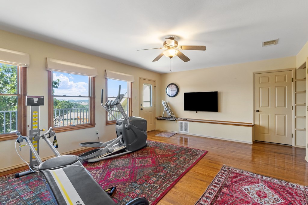 647 Funf Kinder Road Fredericksburg, TX 78624 - Photo 62 of 100 a living room with furniture and a flat screen tv