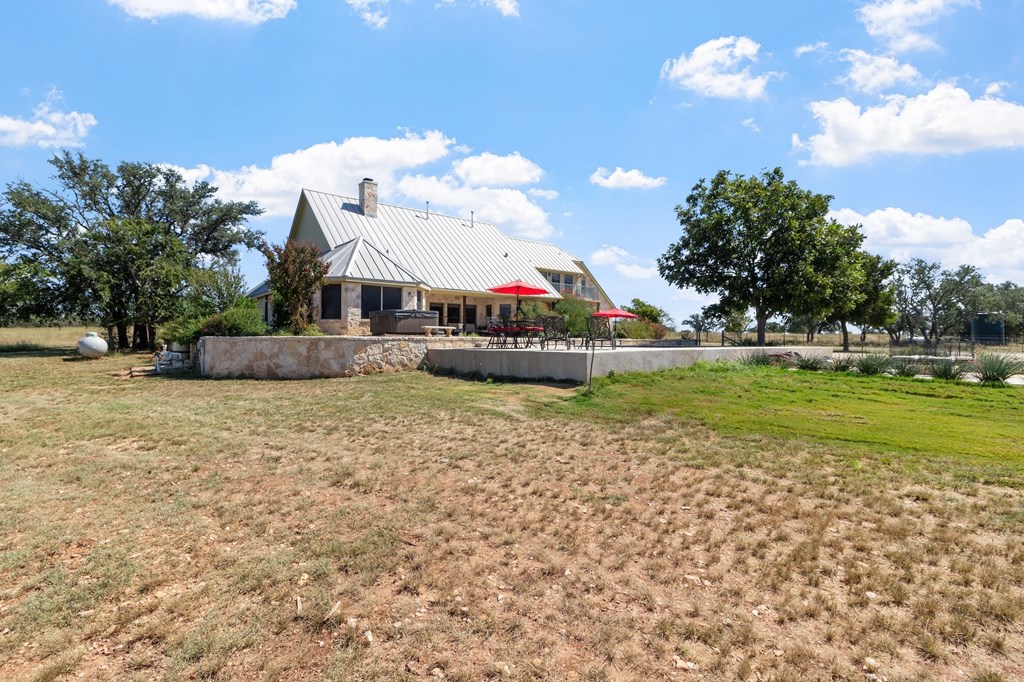 647 Funf Kinder Road Fredericksburg, TX 78624 - Photo 63 of 100 a view of a house with a big yard