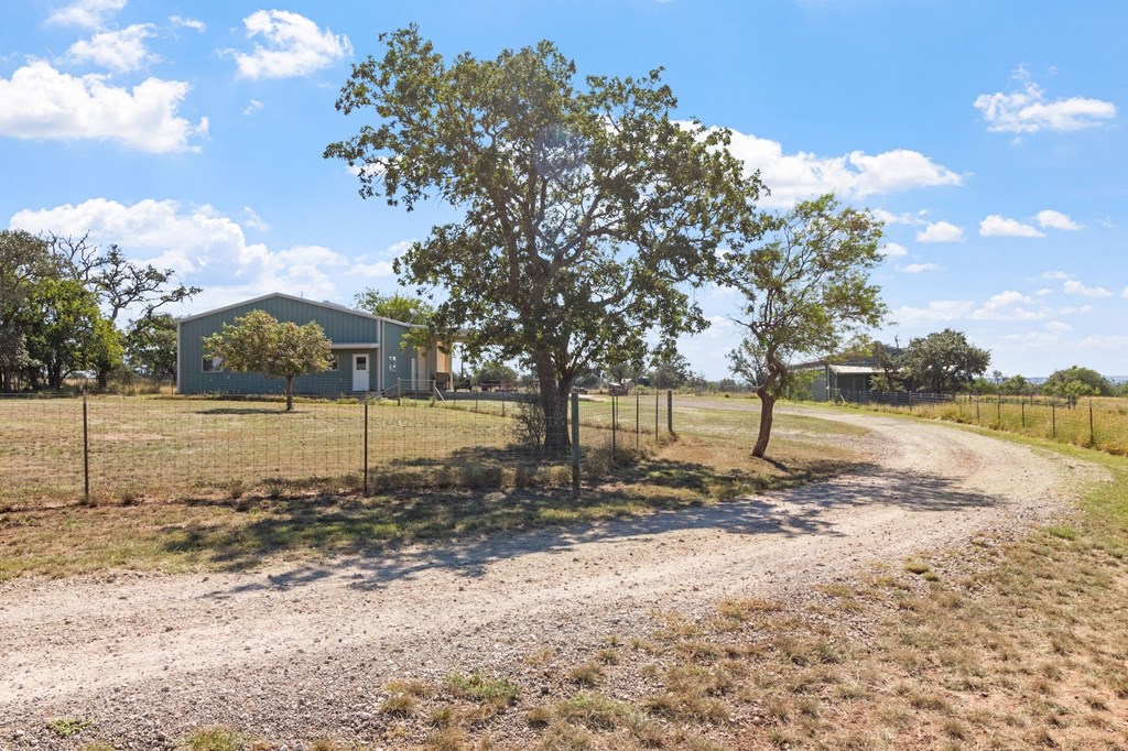 647 Funf Kinder Road Fredericksburg, TX 78624 - Photo 73 of 100 a view of a house with a yard