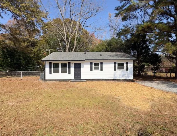 a house with trees in front of it