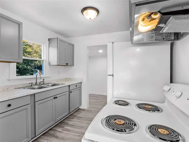 a bathroom with a sink and a window