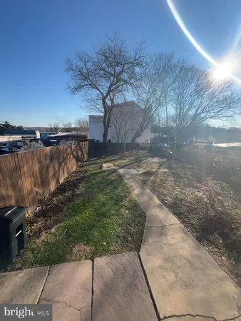 a view of a backyard with pathway