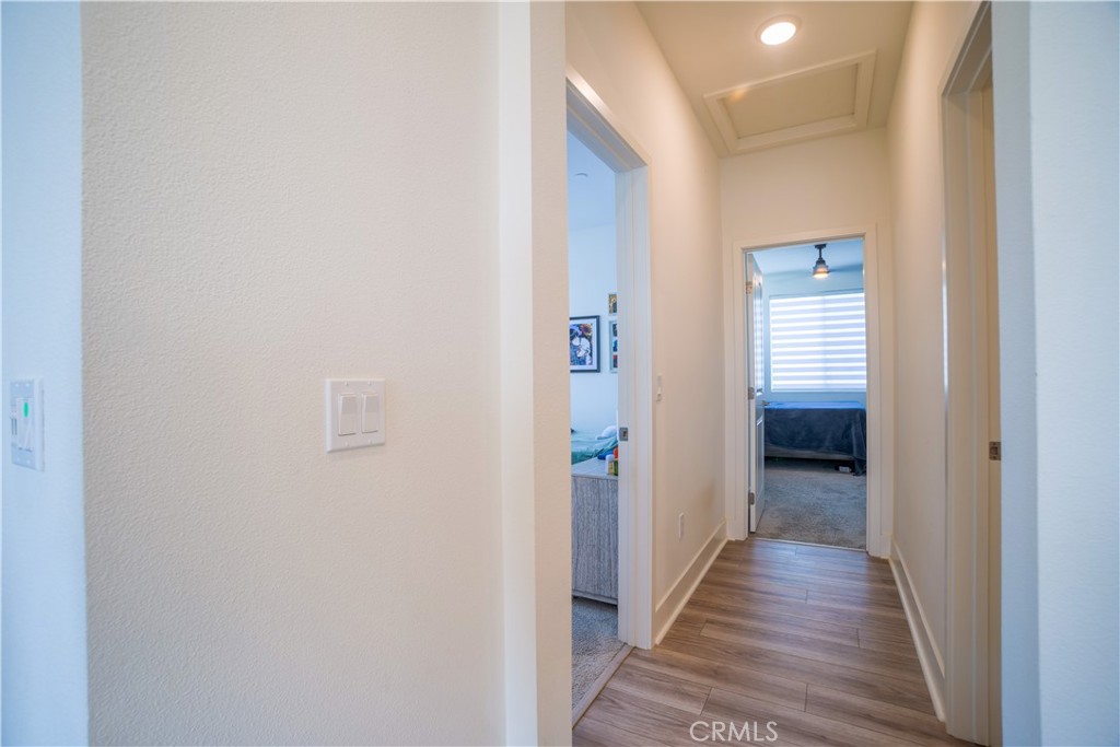35323 Orchard Trail Fallbrook, CA 92028 - Photo 16 of 30 a view of a hallway with wooden floor