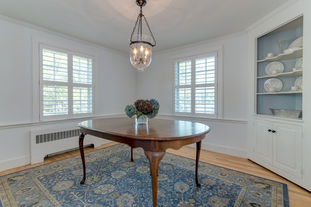 76 Clifton Road Milton, MA 02186 - Photo 14 of 28 a view of a dining room with furniture window and wooden floor