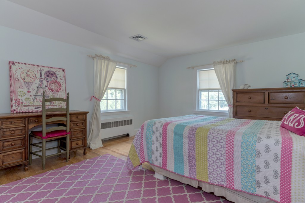 76 Clifton Road Milton, MA 02186 - Photo 17 of 28 a bedroom with a bed and a window
