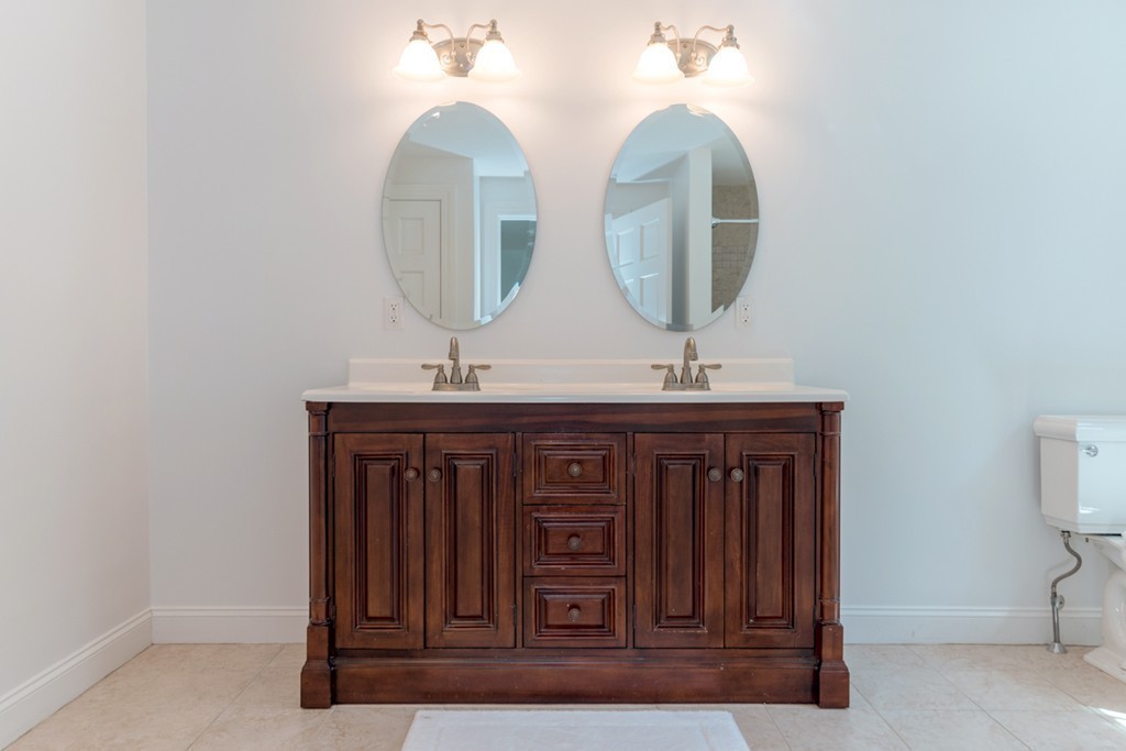 76 Clifton Road Milton, MA 02186 - Photo 21 of 28 a bathroom with a sink and a mirror