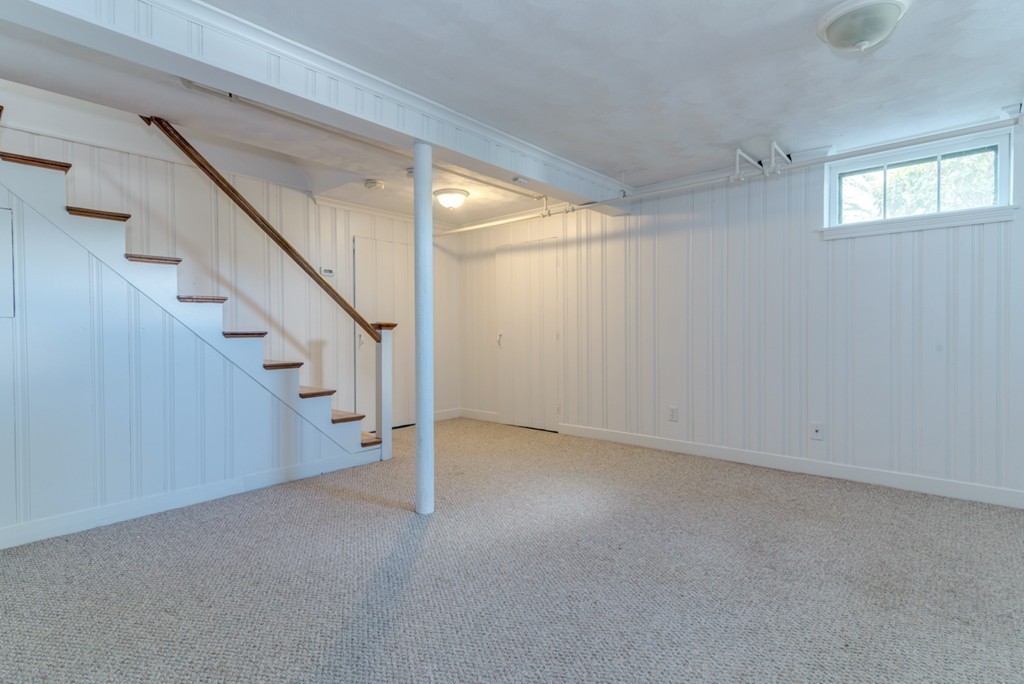 76 Clifton Road Milton, MA 02186 - Photo 23 of 28 a view of an empty room with stairs