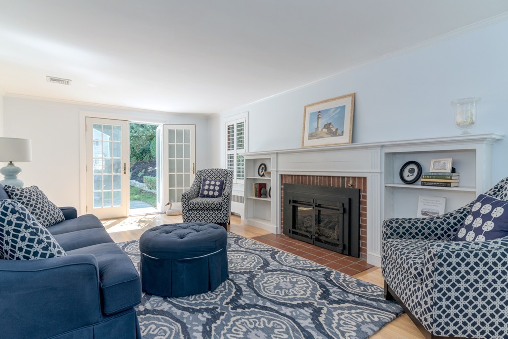 76 Clifton Road Milton, MA 02186 - Photo 4 of 28 a living room with furniture and a fireplace