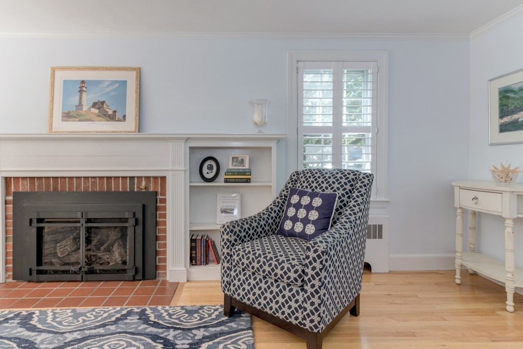 76 Clifton Road Milton, MA 02186 - Photo 5 of 28 a living room with furniture and a fireplace